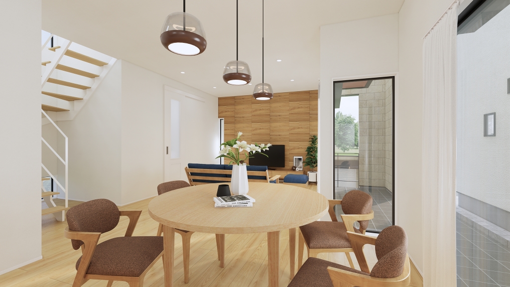 大きな窓から光が差し込む、明るく開放的なリビング。テラスとつながる空間設計で、くつろぎも家族時間も自然に広がる心地よい住まいです。